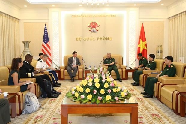 Deputy Minister of National Defence Sen. Lieut. Gen. Nguyen Chi Vinh (R) and Assistant Secretary of Defence for Indo-Pacific Security Affairs in the US Government Randall Schriver