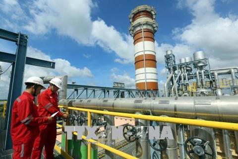 Workers check on equipment at the Nhon Trach Power Plant 2 under PV Power in southern Dong Nai Province. IPO of PetroVietnam's stocks, PV Power's parent-corporation last year contributed to the State's budget some VND7.45 trllion. — VNA/VNS Photo