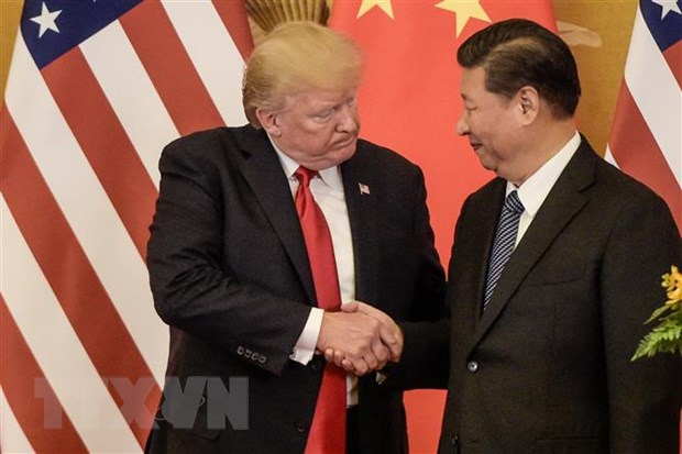 Tổng thống Mỹ Donald Trump (trái) và Chủ tịch Trung Quốc Tập Cận Bình (phải) tại cuộc gặp ở Bắc Kinh ngày 13-5-2019. (Ảnh: AFP/TTXVN)