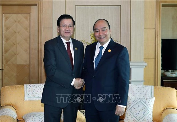 Prime Minister Nguyen Xuan Phuc and Lao counterpart Thongloun Sisoulith meet at the 30th anniversary of ASEAN-RoK dialogue relations in the Republic of Korea in November 2019.