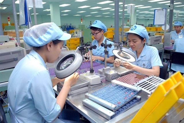 Workers assemble small-sized electric motors at the Japan-owned Mabuchi Motor Việt Nam at the Biên Hoà II Industrial Park in Đồng Nai Province. — VNA/VNS Photo Danh Lam