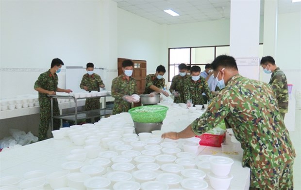 Soldiers prepare meals for people in quarantine in the southern province of Tien Giang