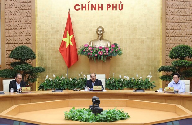 Prime Minister Nguyen Xuan Phuc (centre) chairs the meeting in Hanoi on March 23