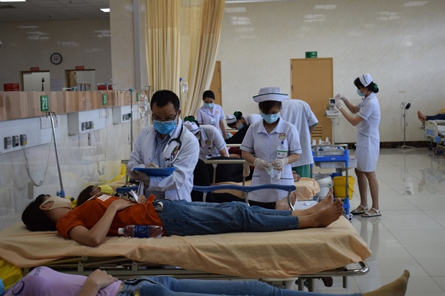 Patients are treated at a local health facility after suffering from food poisoning on Tuesday. — VNA/VNS Photo Lê Xuân