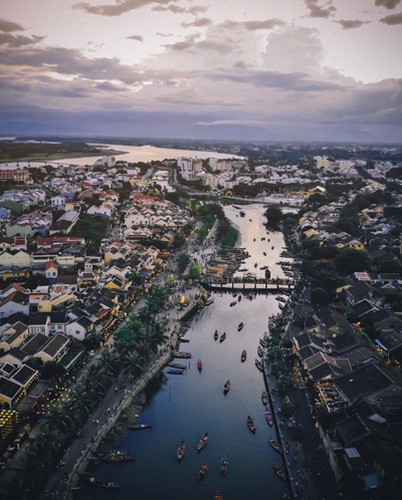 The ancient city of Hoi An appears more picturesque than usual at sunset. 