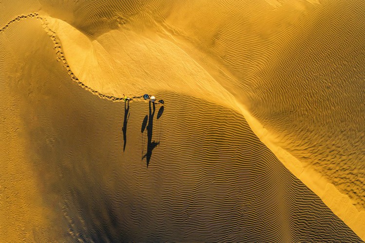 The Nam Cuong sand dune boasts a unique beauty as it falls under the glare of the sun.