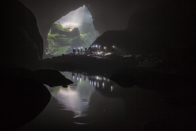 A group of adventurers far in the distance take part in an exploration of Son Doong cave, the largest of its kind worldwide.