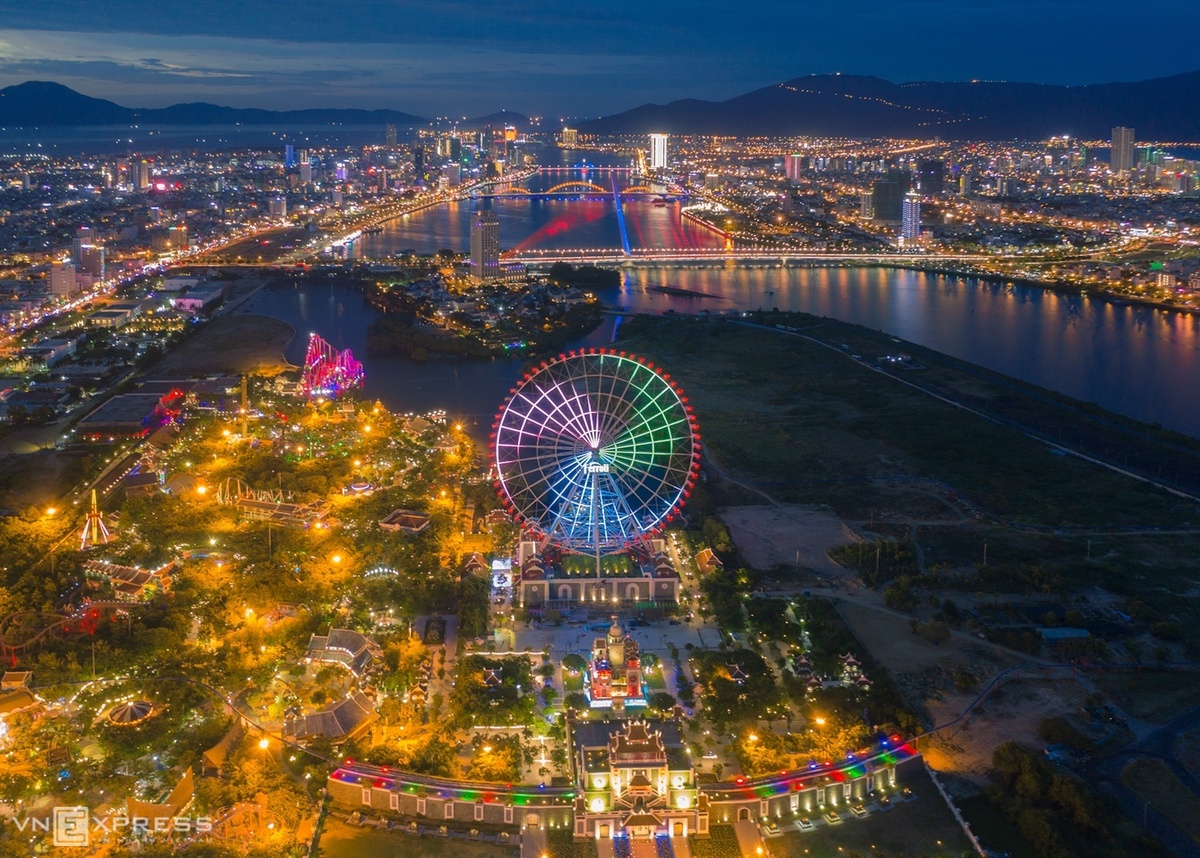 Da Nang City glows with lights from buildings, resorts and especially bridges.  The city is dubbed “City of Bridges” with constructions like, Han, Rong and Thuan Phuoc Bridge.  In the photo is the Sun Ferris Wheel, one of the largest in the world. The entire city can be seen from the Ferris wheel.  Da Nang, one of Vietnam’s five biggest cities, is home to My Khe, one of Southeast Asia’s most beautiful beaches, the Golden Bridge, Ba Na Hills, and Asia Park.