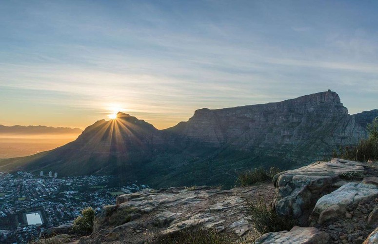 Cape Town of South Africa  Love Exploring details how visitors can watch dawn break at around 6am in the summer months from either the ground around Cape Town’s picturesque waterfront, or head up the Table Mountain on foot.