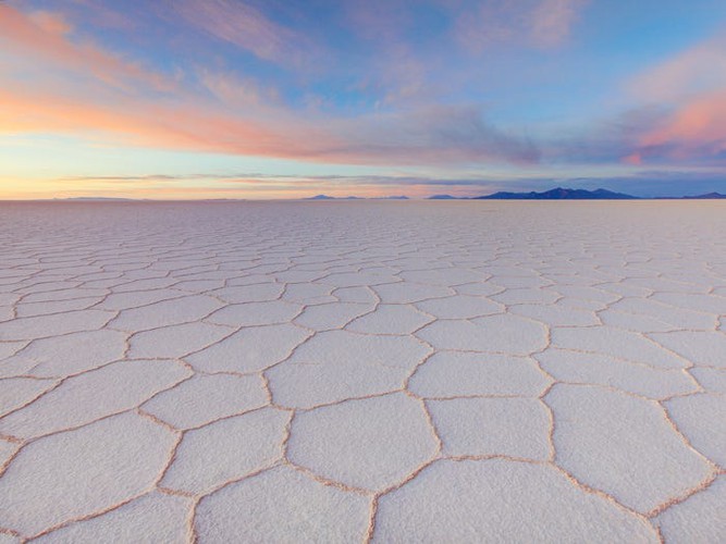 Salar de Uyuni in Bolivia is the largest salt flat in the world according to National Geographic, with the salt-covered ground often creating mind-blowing, mirror-like effects.