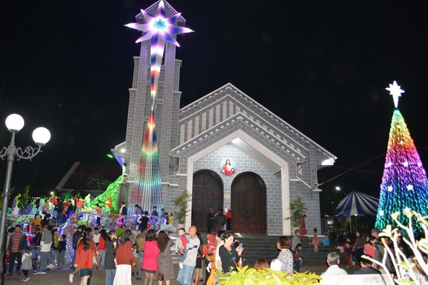 People gather at the Cathedral in Buon Ma Thuot city, Dak Lak province to celebrate Christmas 2020.