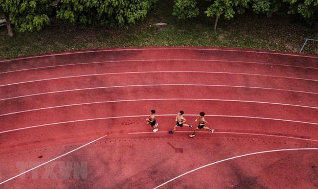 Vietnamese track and field athletes in a training session. (Photo: VNA)