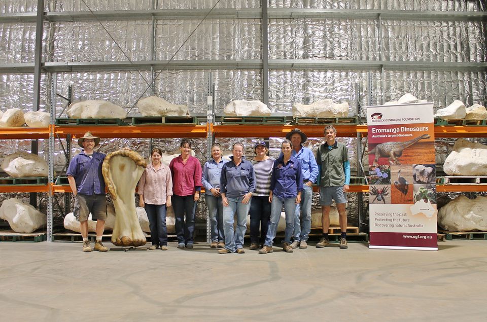 A field research team poses with a 3D reconstruction of the humerus bone and other dinosaur bones in plaster jackets from "Cooper," a new species of dinosaur discovered in Queensland and recognised as the largest ever found in Australia, in this undated handout image made available to Reuters on June 8, 2021 in Eromanga, Australia. 