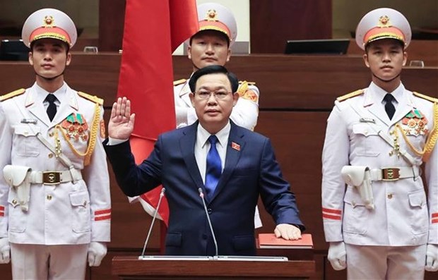 NA Chairman Vuong Dinh Hue takes oath at the event.