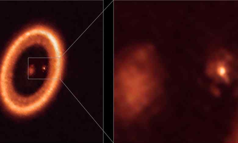 An undated image, taken with the Atacama Large Millimeter/submillimeter Array (ALMA), in which the European Southern Observatory is a partner, shows wide (left) and close-up (right) views of the moon-forming disc surrounding PDS 70c, a young Jupiter-like planet nearly 400 light-years away. 