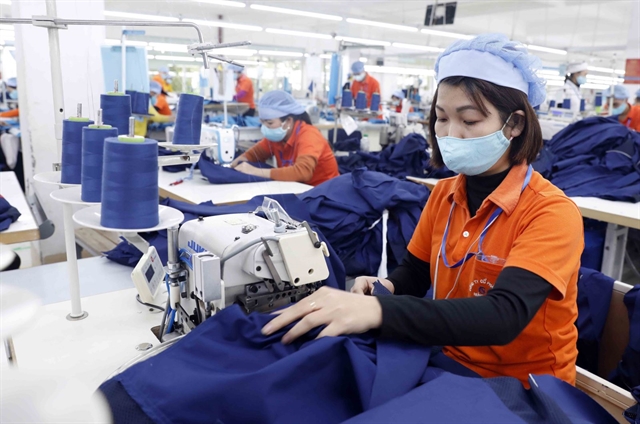 Many garment enterprises have found solutions to maintain production in the context of COVID-19 pandemic. VNA/VNS Photo Trần Việt