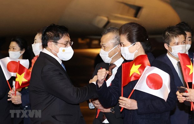 Vietnamese Prime Minister Pham Minh Chinh is welcomed at Haneda airport in Tokyo.