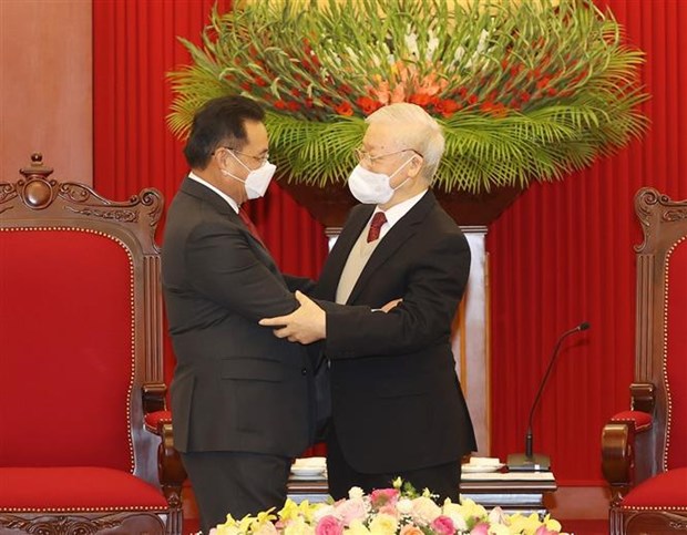 Party General Secretary Nguyen Phu Trong (R) and Chairman of the Lao National Assembly Xaysomphone Phomvihane at their meeting in Hanoi on December 7.