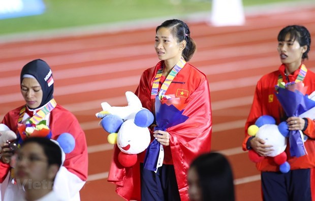 Athletes winning medals at a SEA Games competition (Photo: VNA)