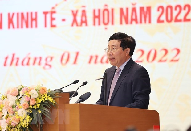 Standing Deputy Prime Minister Pham Binh Minh speaks at the event.