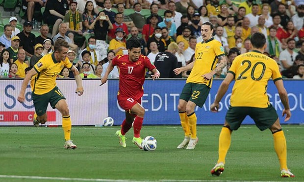 Vietnam (in red) lost 4-0 to Australia on January 27 (Photo: Vietnam Football Federation)