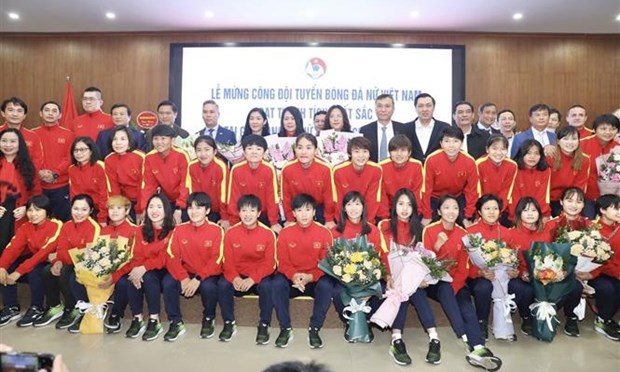 Members of the women's football team pose for a group photo at the event (Photo: VNA)