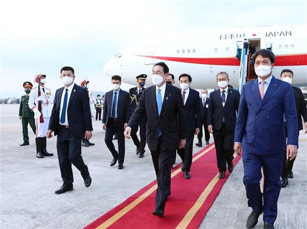 Japanese Prime Minister Kishida Fumio (first row, centre) and his entourage arrive at the Noi Bai international airport in Hanoi.