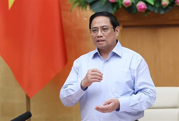 Prime Minister Pham Minh Chinh addresses the meeting.