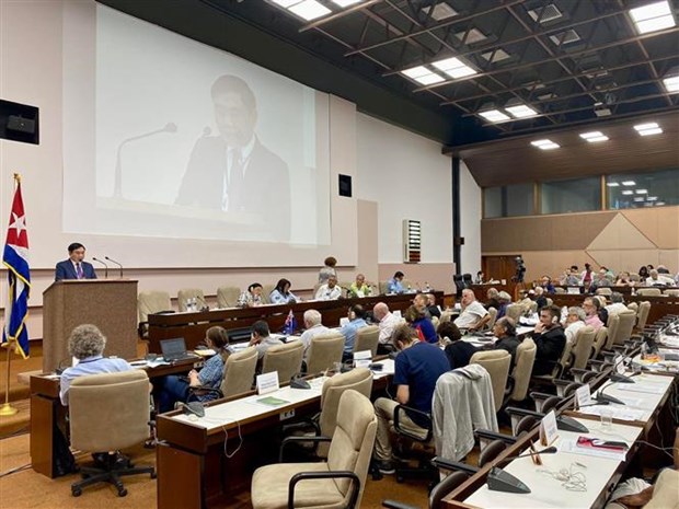 Deputy head of Party Central Committee's Commission for Internal Affairs Tran Quoc Cuong speaks at the 22nd IMWCP 