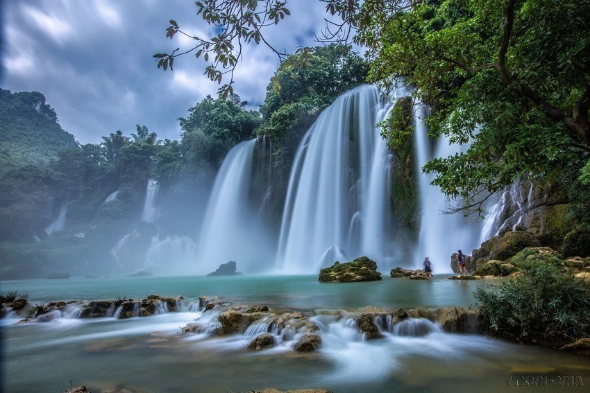 Laying at the foot of the waterfall is a river.