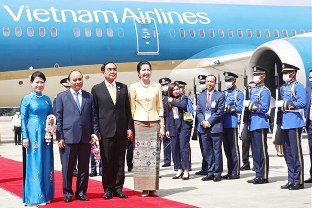 Thai Prime Minister Prayut Chan-o-cha and his spouse (R) welcome President Nguyen Xuan Phuc and his spouse at Don Mueang International Airport in Bangkok on November 16. 