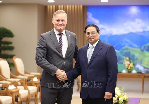 Prime Minister Pham Minh Chinh (R) and new-appointed Danish Ambassador to Vietnam Nicolai Prytz. 