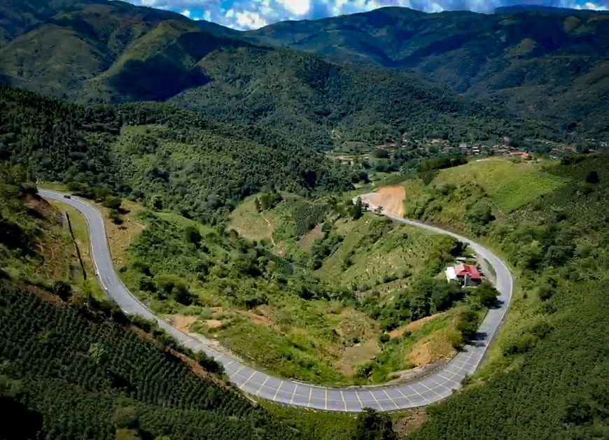 A curve winding around the mountains. 