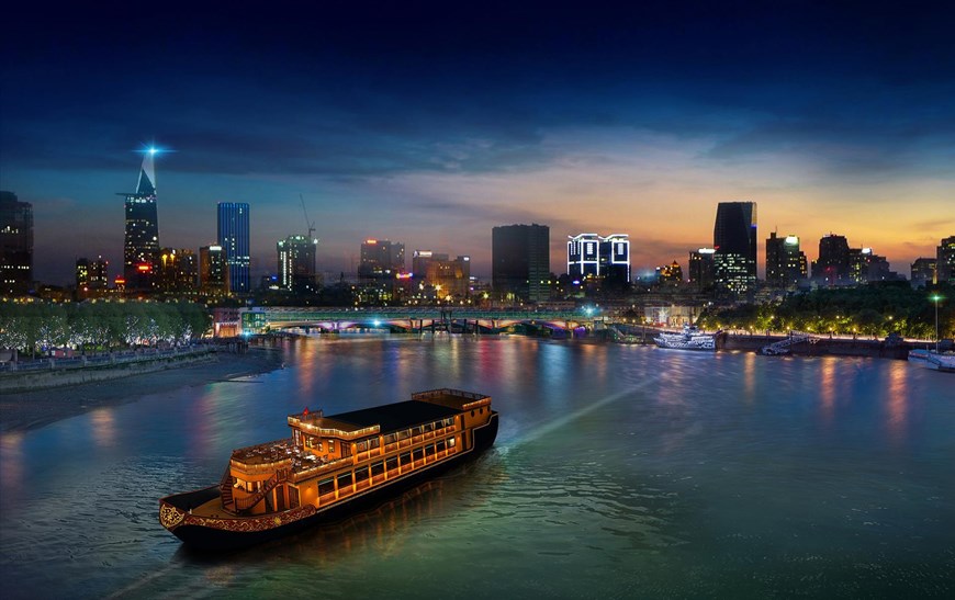 Contemplating the twilight by the Sai Gon River.